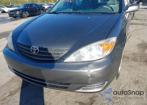 2004 Toyota Camry Le z USA, uszkodzony, nr VIN 4T1BE32K14U850479